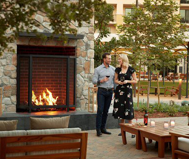 Couple by Vista Collina Fireplace
