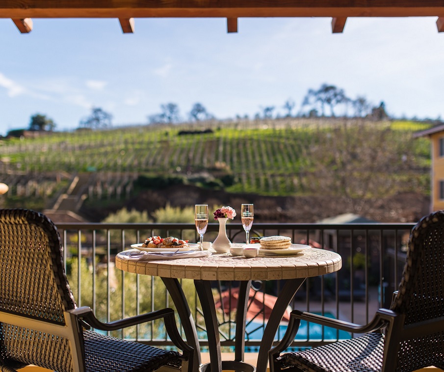 breakfast on balcony with vineyard view